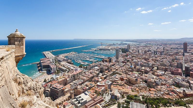 Alicante's city and marina viewed from the castle hillside in Spain.