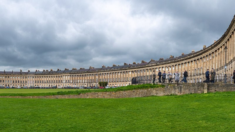 Royal Crescent overlooking its green lawn in Bath