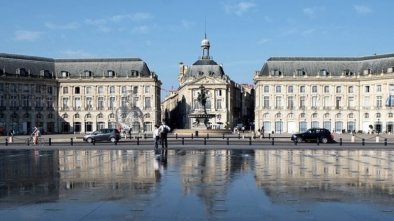 Place de la Bourse reflected in the water mirror in Bordeaux, France.