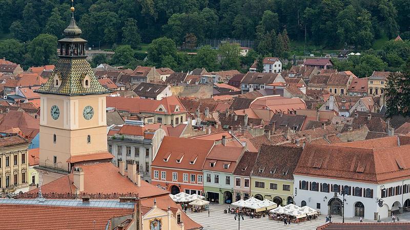 Council House and Council Square above the rooftops of Brașov, Romania.