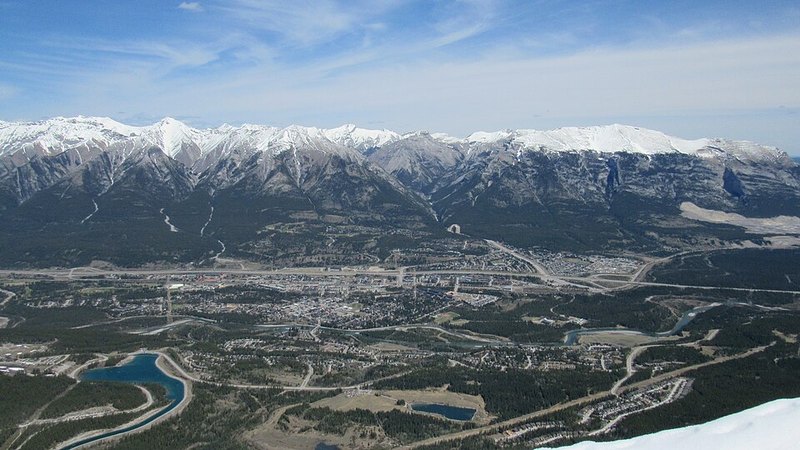 Canmore and the Bow Valley beneath the snow-covered Fairholme Range, viewed from Ha Ling Peak.
