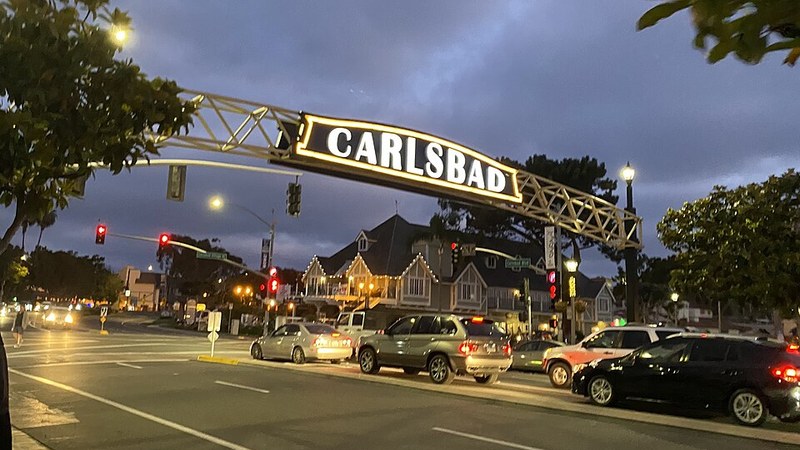 Illuminated Carlsbad sign above downtown Carlsbad Boulevard in California