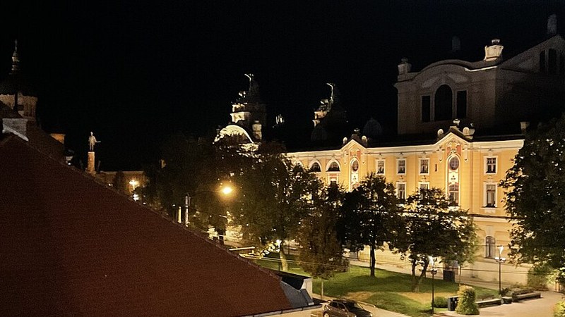 The Romanian Opera building illuminated at night in Cluj-Napoca, Romania.