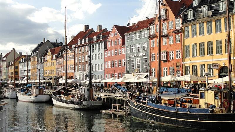 Colorful waterfront buildings and boats along Nyhavn in Copenhagen