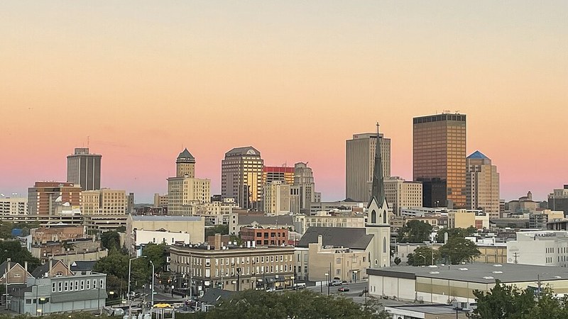 Dayton, Ohio, skyline under a warm sunset sky.