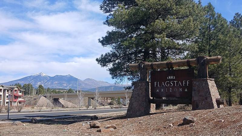 Flagstaff landmark sign with the San Francisco Peaks in northern Arizona