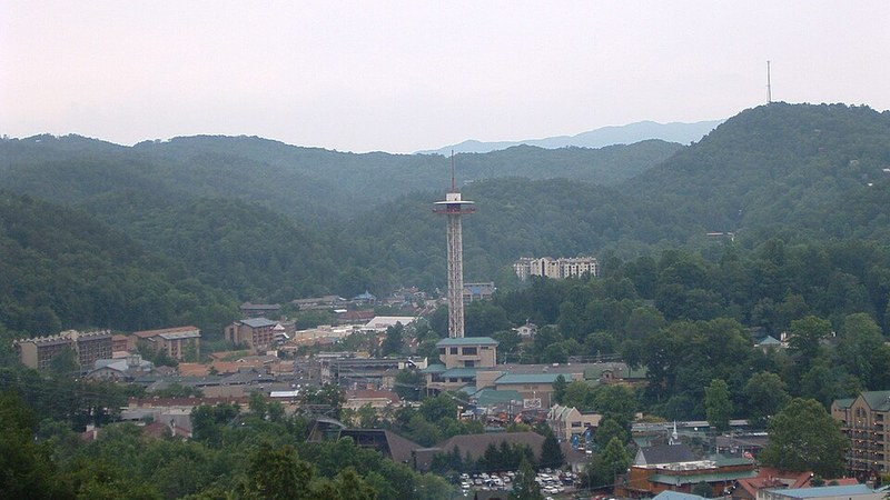Downtown Gatlinburg, Tennessee, surrounded by wooded mountains.