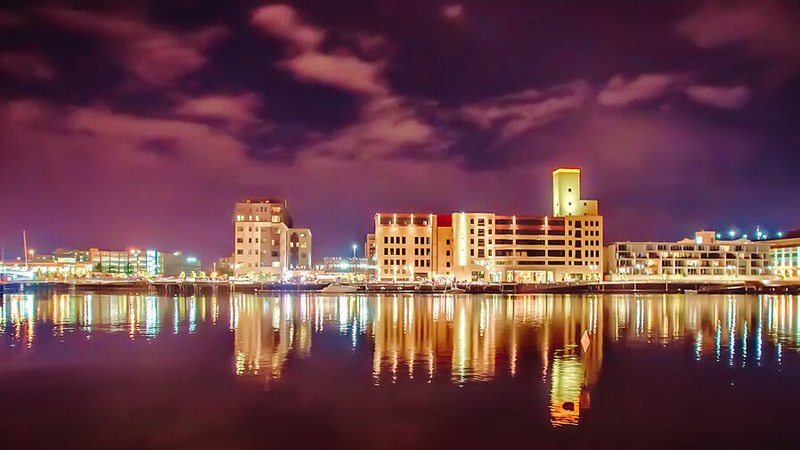 Downtown Green Bay illuminated across the Fox River at night