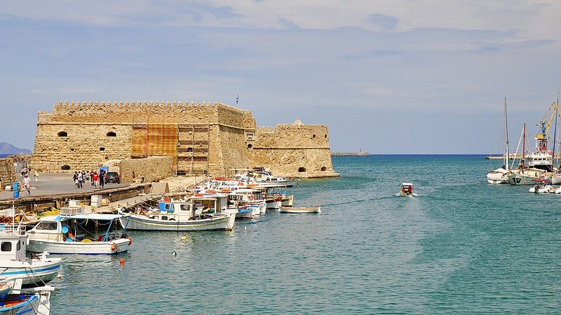Koules Fortress and boats in Heraklion's Venetian harbor, Greece.