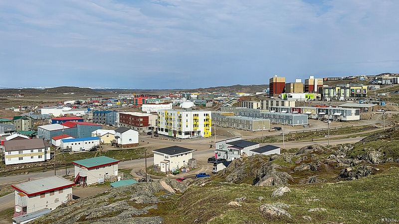 Iqaluit, Nunavut, with colourful buildings and streets across a rocky Arctic landscape.