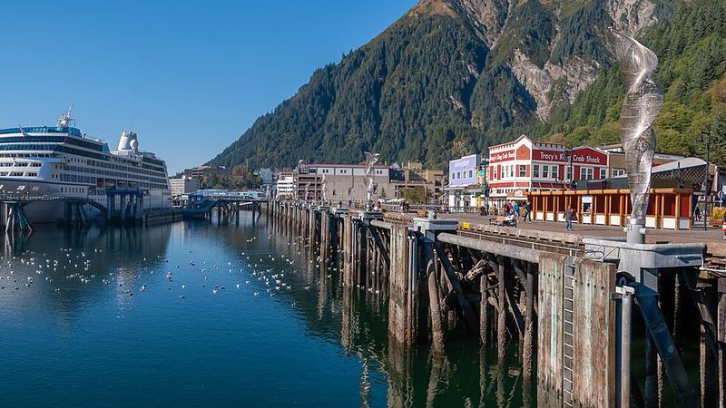 Juneau waterfront and downtown buildings beneath mountains in Alaska
