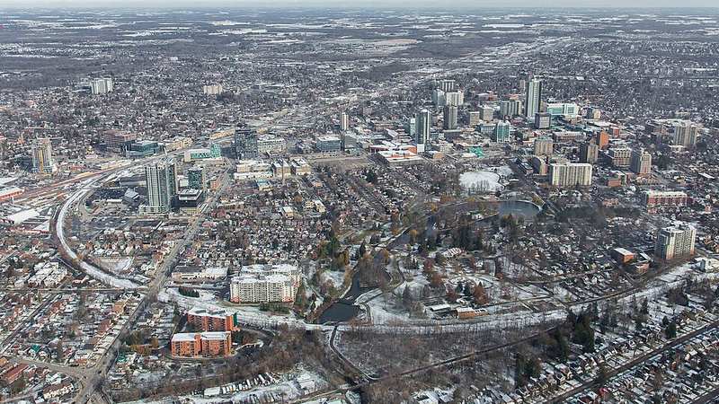 Aerial winter view of downtown Kitchener with Victoria Park in the foreground.