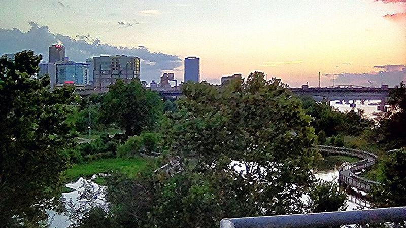 Little Rock skyline and riverside park at dusk, Arkansas.