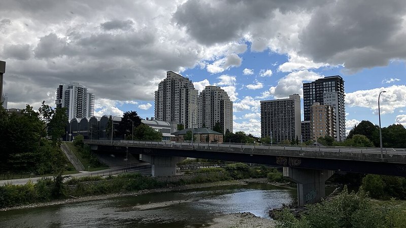 Downtown London, Ontario towers beside a bridge over the Thames River.