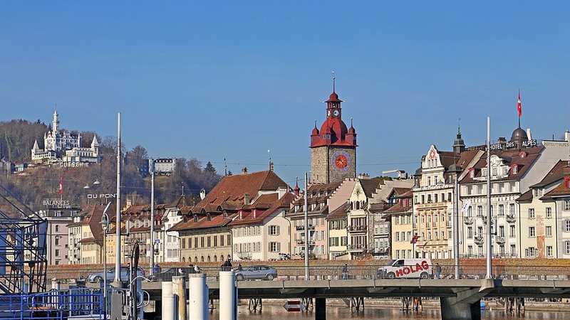 Lucerne's waterfront buildings and clock tower in Switzerland.