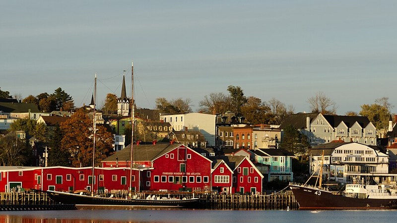 Lunenburg waterfront with the red Fisheries Museum of the Atlantic and moored vessels in Nova Scotia.