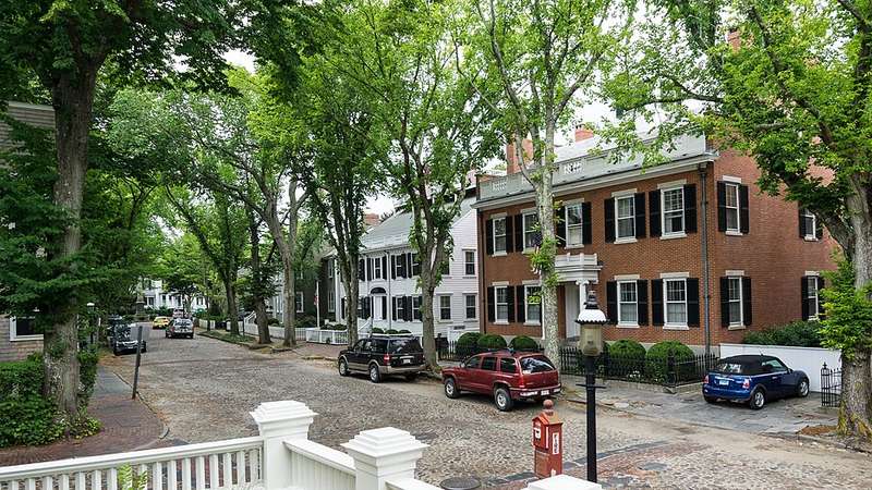Tree-lined cobblestone Main Street on Nantucket, Massachusetts.