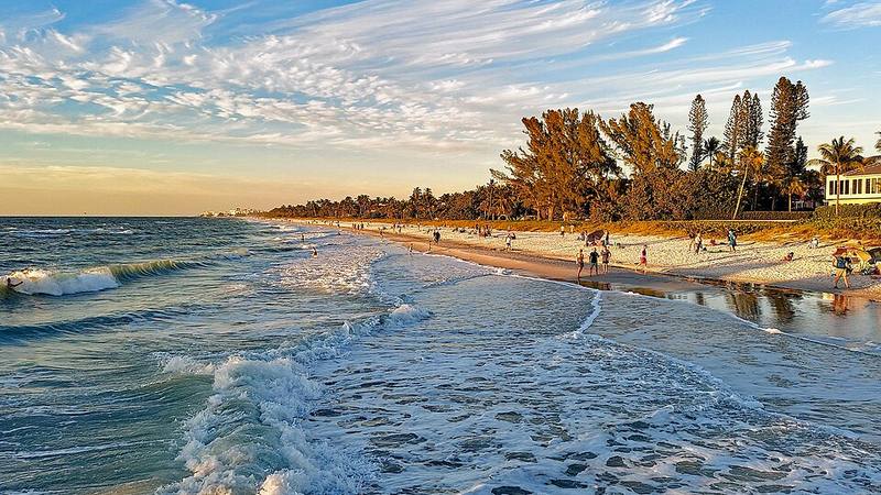 Waves and sandy beach in Naples, Florida.