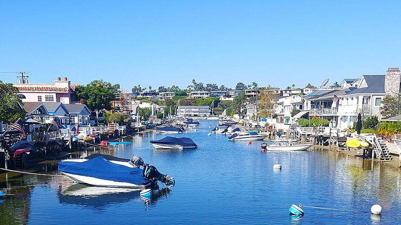 Homes and boats along the Grand Canal in Newport Beach, California.