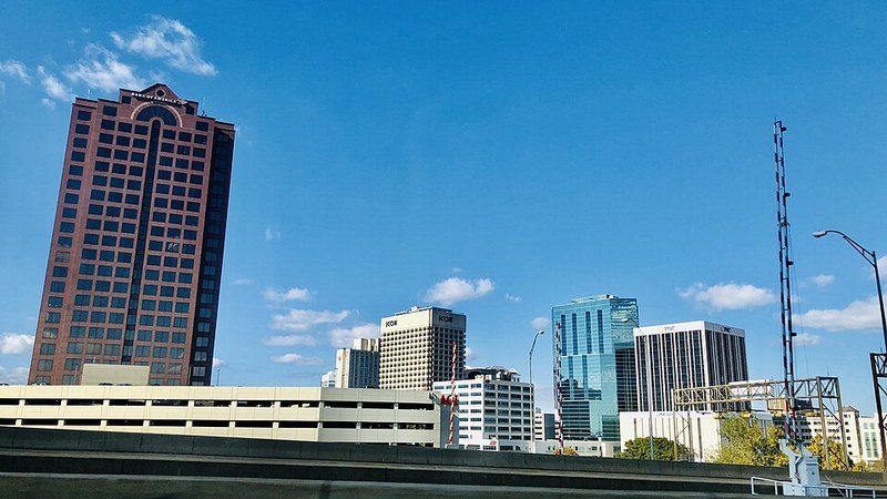 Downtown Norfolk, Virginia, skyline beneath a blue sky.