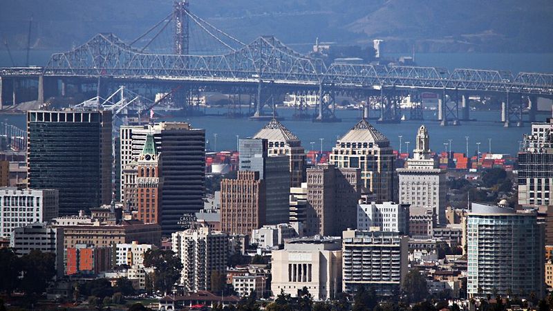 Downtown Oakland skyline with the Bay Bridge in the background, California.