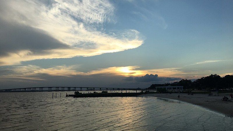 Sunset over Front Beach and its pier in Ocean Springs, Mississippi.