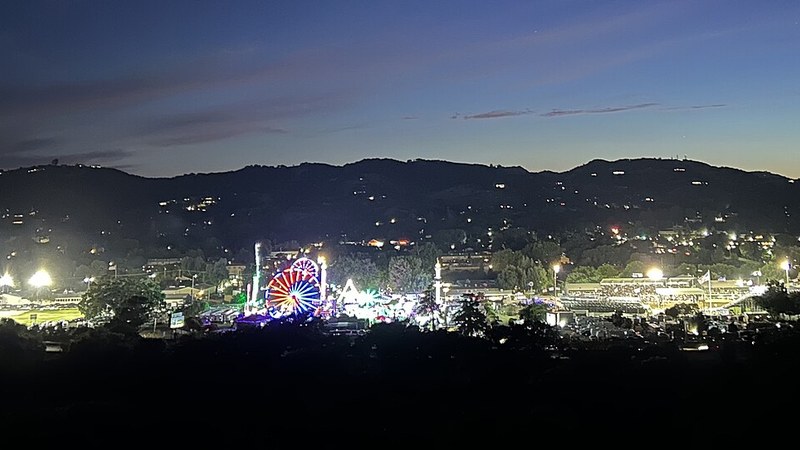Lights of the California Mid-State Fair against the hills of Paso Robles.
