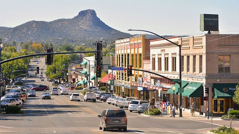 Downtown Prescott streets and storefronts with a mountain backdrop in Arizona