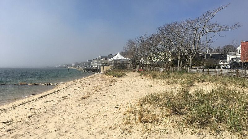 Sandy shore and waterfront buildings in Provincetown, Massachusetts.