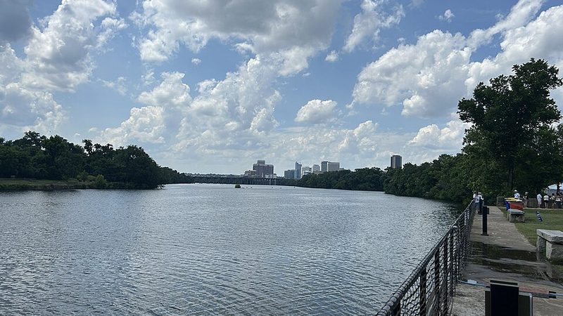 Richmond skyline beyond the James River and green riverbanks