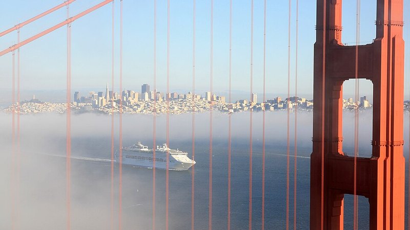 Golden Gate Bridge, San Francisco and a cruise ship in fog.