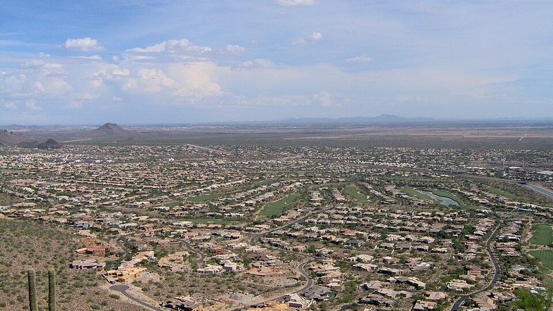 Scottsdale neighborhoods and desert mountains viewed from a hillside