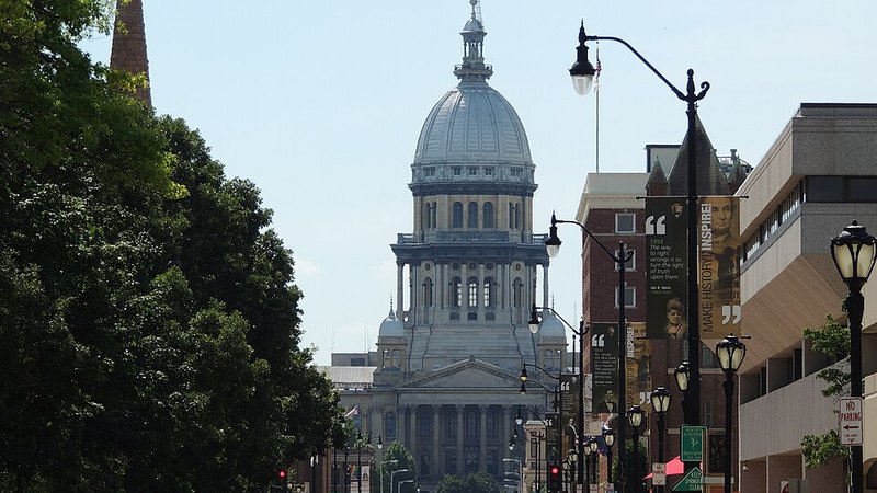 The Illinois State Capitol seen along a downtown street in Springfield.