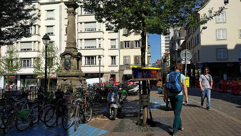 Pedestrian street and historic buildings in Strasbourg, France.