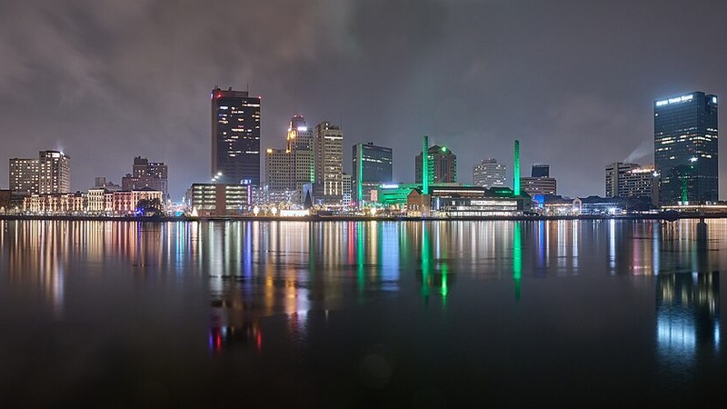 Toledo, Ohio, skyline reflected in the Maumee River at night.