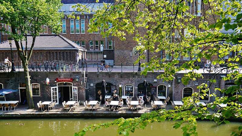 Canalside terraces along the Oudegracht in Utrecht, Netherlands.