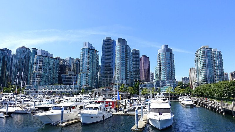 Vancouver waterfront towers rising behind a marina of yachts in British Columbia.