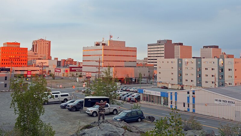 Downtown Yellowknife buildings illuminated by late evening summer sunlight in the Northwest Territories.
